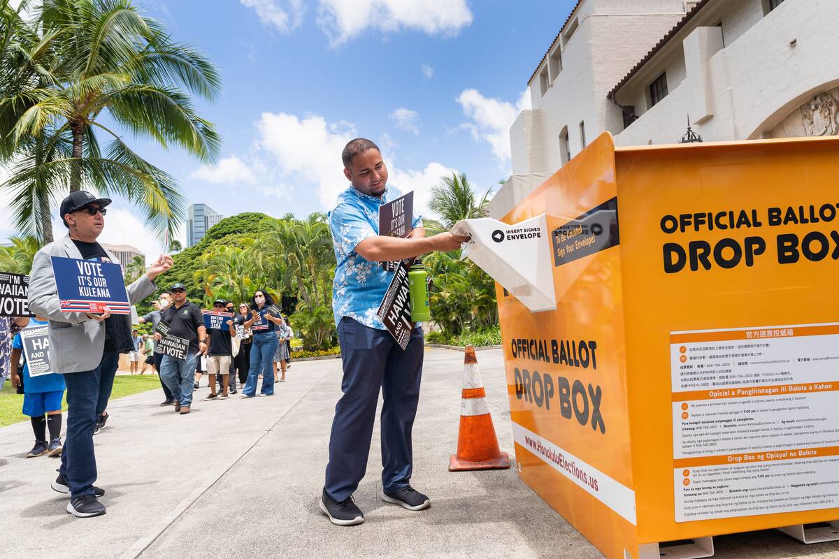 Community member casting a ballot during Walk to the Box